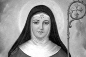 św. Beatrycze de Silva Meneses Czarno-biały portret świętej Beatrycze de Silva Meneses w habicie, z aureolą i ozdobnym pastorałem obok postaci.