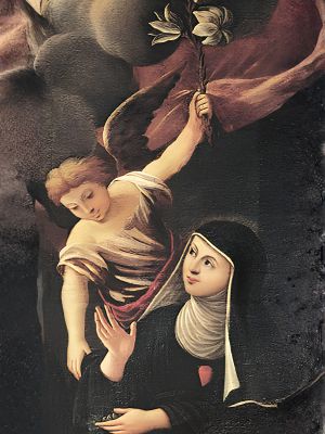 Święta Klara z Montefalco z aniołem trzymającym w dłoni lilię symbol dziewictwa.