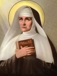 Święta Joanna Antyda Thouret portret w habicie z księgą reguł zakonnych w dłoniach.