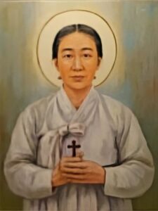 Święta Agata Yi Kan-nan portret koreańskiej męczennicy z krzyżem w dłoniach.
