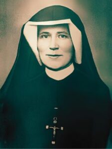 Święta Faustyna Kowalska portret zakonnicy w habicie.