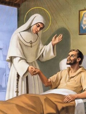 Św. Maria Soledad Torres Acosta w białym habicie przy łóżku chorego.